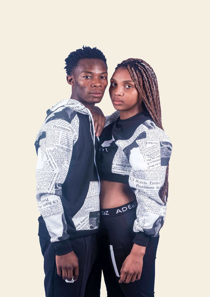 couple's black paper print track hoodie with a modern and stylish design, perfect for urban and athletic wear.