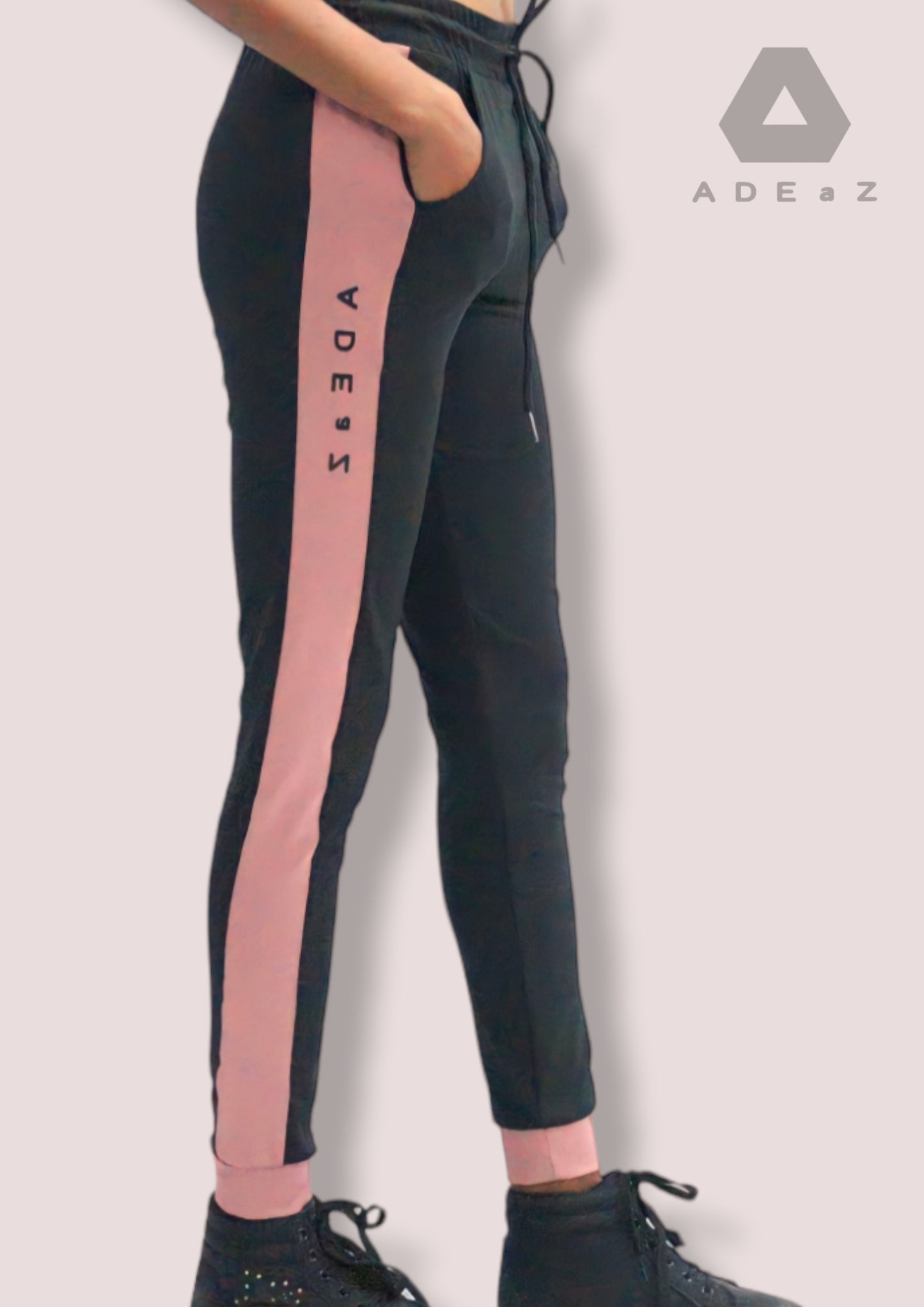 Poly spandex sweatpants featuring jewel-striped accents, blending comfort with a touch of elegant and vibrant detailing.