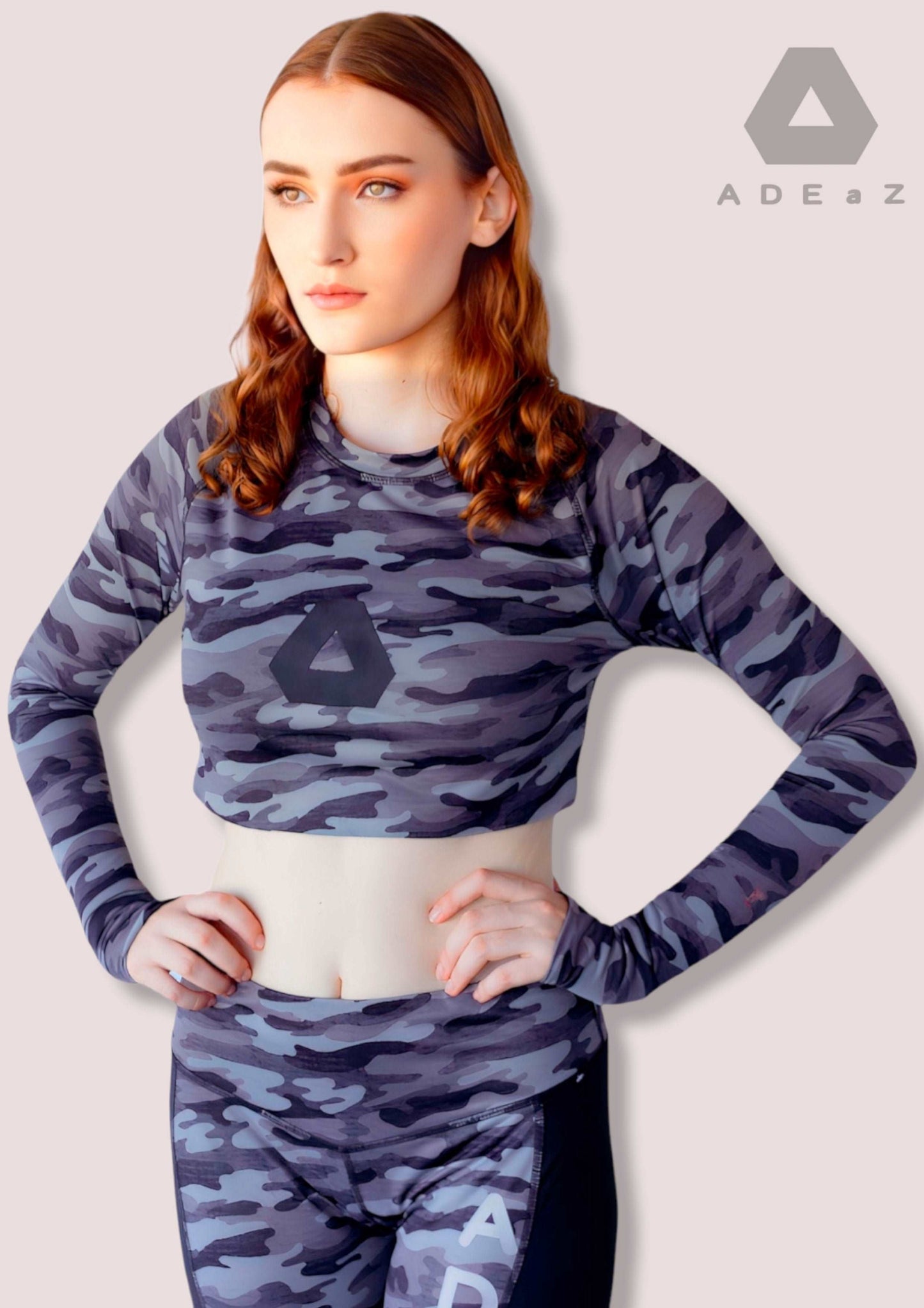 Camo Crop Top with Thumbhole: Camouflage patterned sleeveless crop top with built-in thumbholes for added style and comfort.