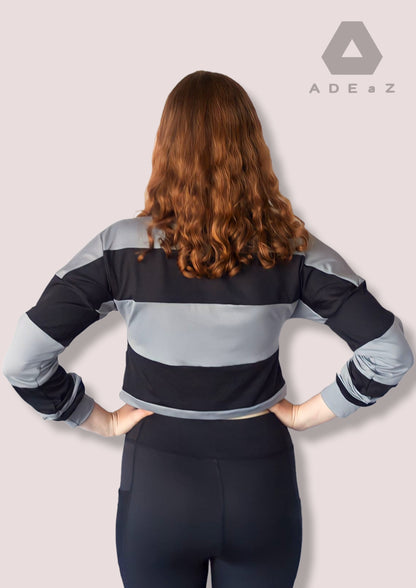 Women's long-sleeve collar crop top in soft colors, offering a stylish blend of sophistication and trendy design.