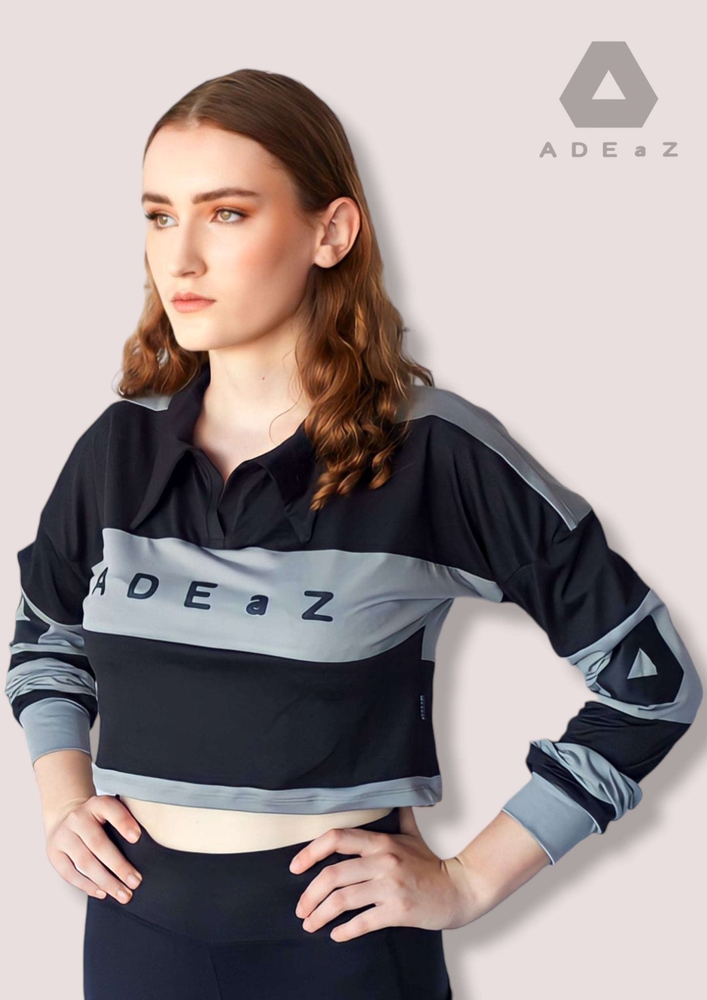 Women's long-sleeve collar crop top in soft colors, offering a stylish blend of sophistication and trendy design.