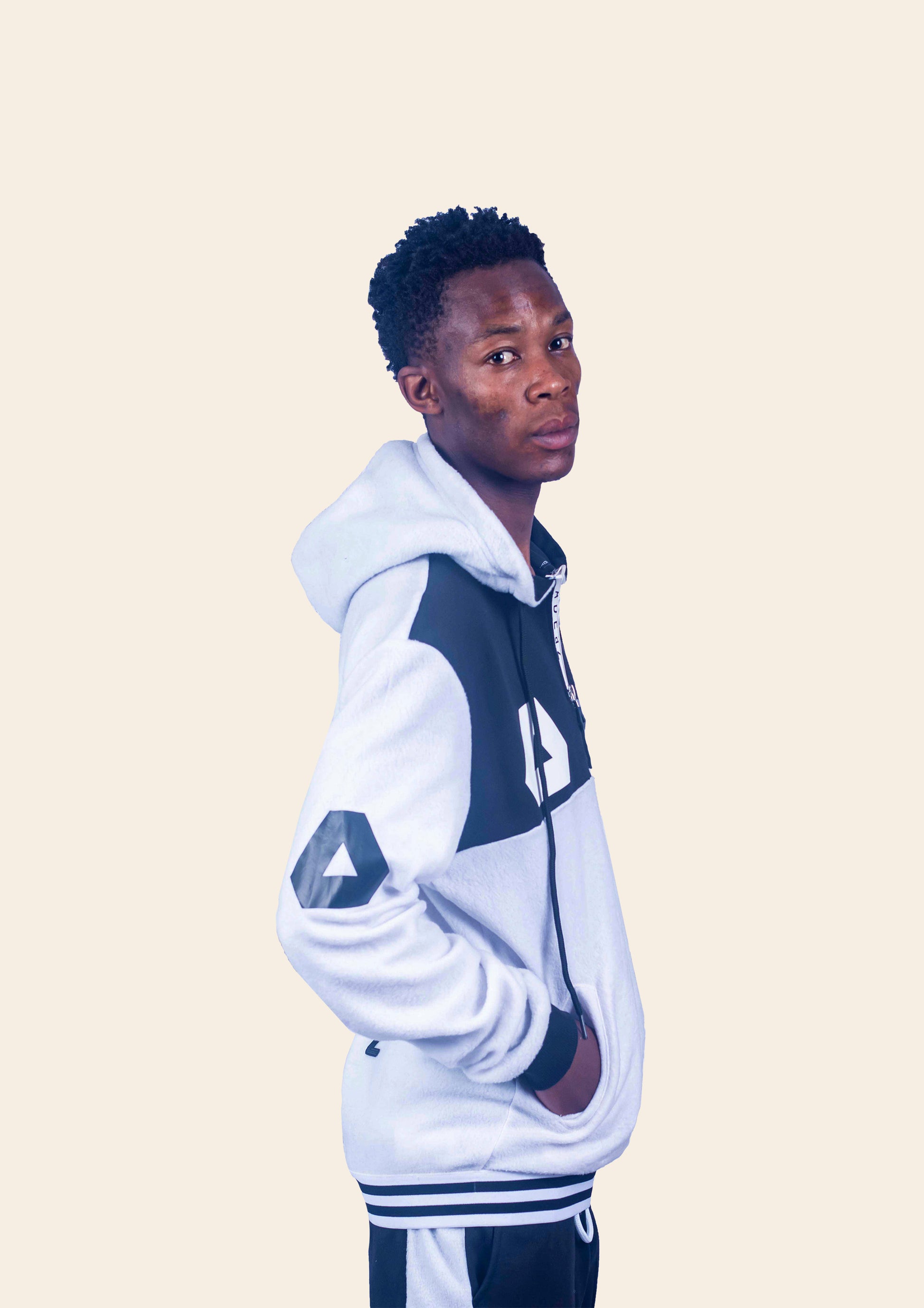 https://adeaz.ca/cdn/shop/products/Omali_Themba_wearing_Man_s_sporty_hoodie.jpg?v=1708933862&width=1946